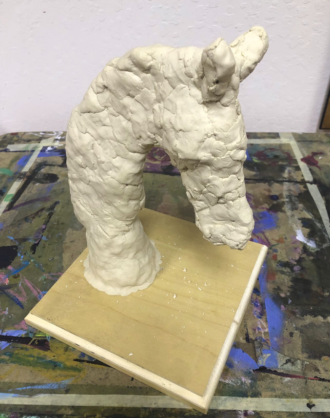 Clay-covered sculpture