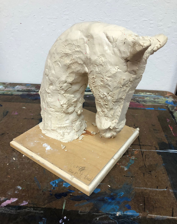 Additional clay added to sculpture